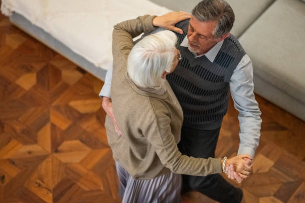 istock Elegant Senior Couple Dancing at Home 2177719056