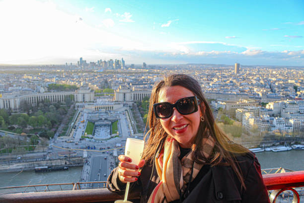 Image of a woman in the top of the Eiffel Tower in Paris