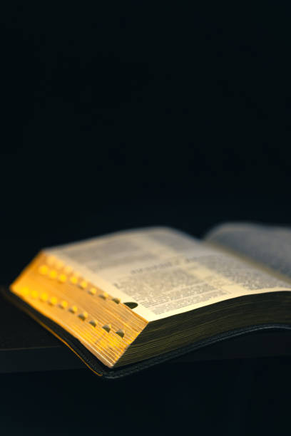 istock Open Bible on a black background. Religion concept. 2177720349