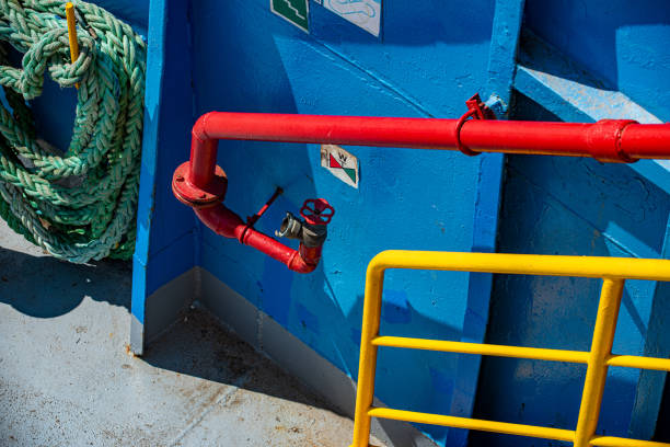 The ferry's blue painted hull and passenger handrails