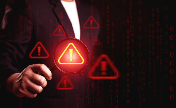 istock Danger and error alert concept. Businessmen use magnifying glass to find symbol notification warning triangle. 2177721184