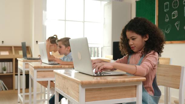 istock American girl learning about prompt while student sitting at class. Pedagogy. 2177721255