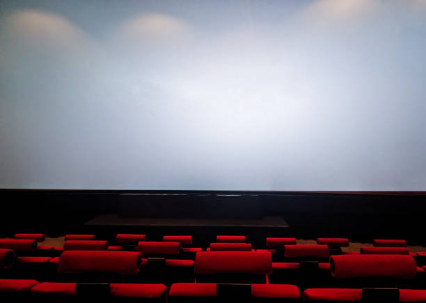 Moving Behind the Chairs in Abstract Cinema Hall