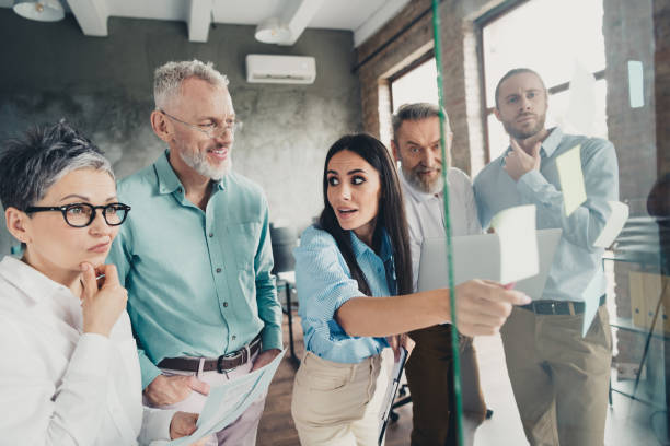 istock Photo of teamwork startup partners thinking team brainstorming sticky notes comfortable nice creative startup office loft room interior 2177722814