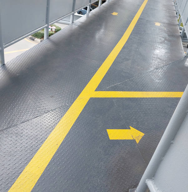 istock Yellow direction sign on the floor of the overpass 2177724496