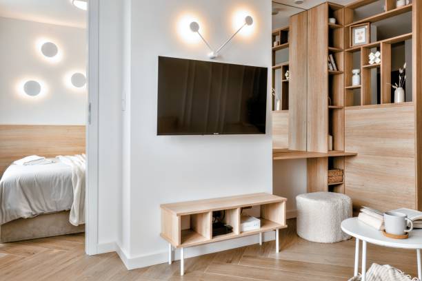 A Contemporary Modern Minimalist Living Room that Features an Integrated Workspace Effectively