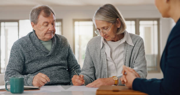 istock Signature, documents and senior couple with financial advisor for retirement annuity saving account. Discussion, finance paperwork and elderly man and woman with investment banker for pension growth. 2177728595