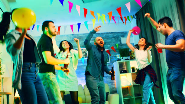 istock Cheerful group of young people dancing and socializing 2177731722