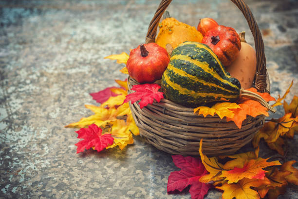 istock Autumn background with pumpkins and colorful leaves 2177734236