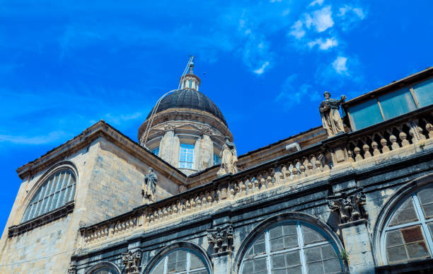istock Exploring Dubrovnik's architectural beauty under a clear blue sky in Croatia with historic statues adorning the rooftop 2177739295