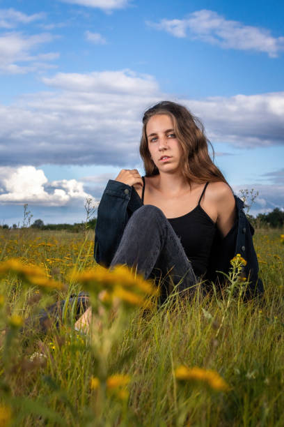 Beautiful young hungarian woman in a field on a summer day