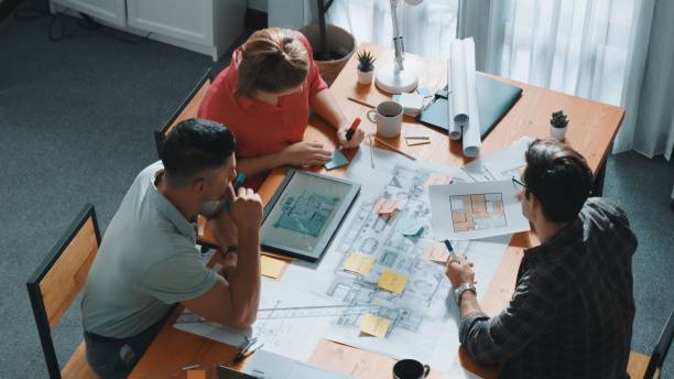 istock Top view of smart team working together to plan house construction. Symposium. 2177741876
