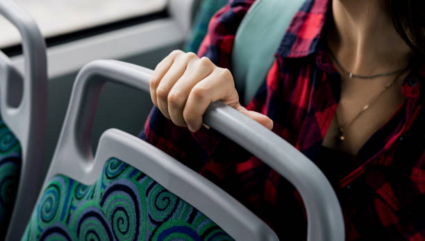 istock close-up of a hand holding onto a seat 2177743546