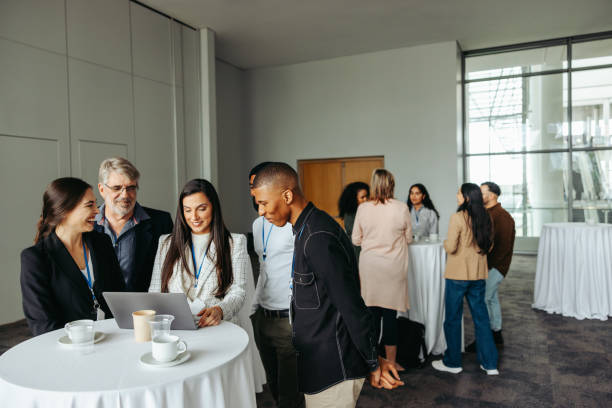 istock Business professionals engaging in lively discussions during a conference tea break 2177745401
