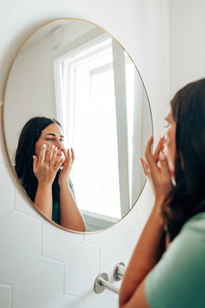 istock woman using make up in the bathroom 2177746747