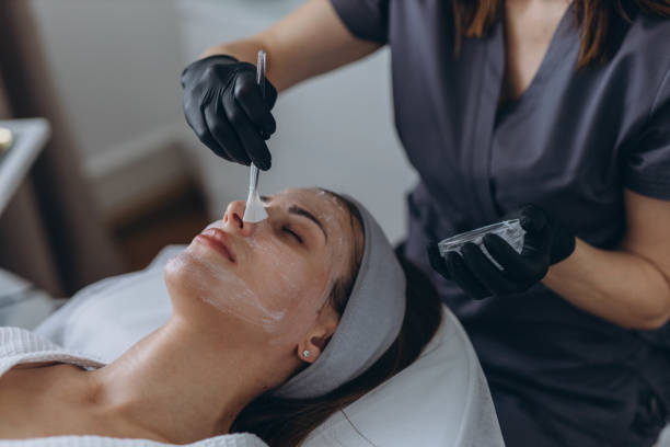 istock Cosmetologist performs a facial peeling procedure on a young woman. 2177747714