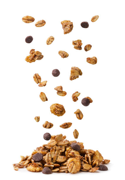 istock Chocolate granola falling on a pile on a white background. Isolated 2177751094