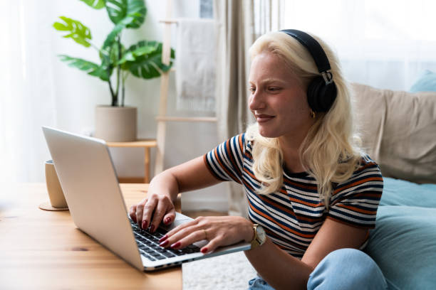 istock Young introvert freelancer businesswoman with ADHD working remotely from home office on laptop computer. Business person avoiding crowded office and people by working alone at apartment on computer. 2177752869