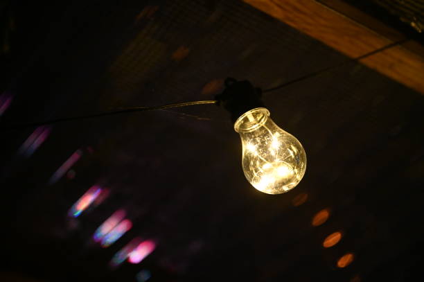istock light bulb turned on at night. concept of light and electricity expenses. 2177753360