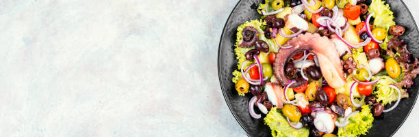 istock Grilled octopus with salad on a plate. 2177753642