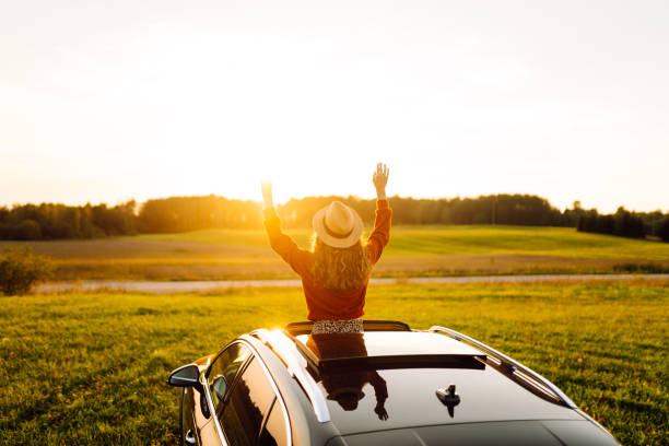 istock Relaxed woman on summer road trip enjoying window view. 2177756685