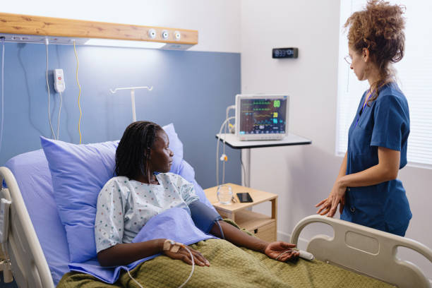 istock Nurse talking with her patient during a medical exam 2177758994