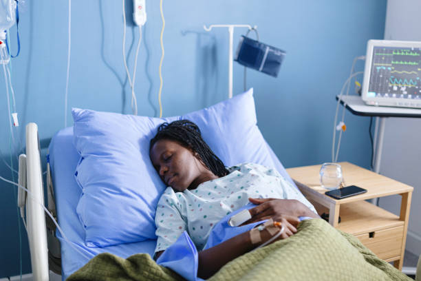 istock Black woman sleeping in the hospital 2177759633