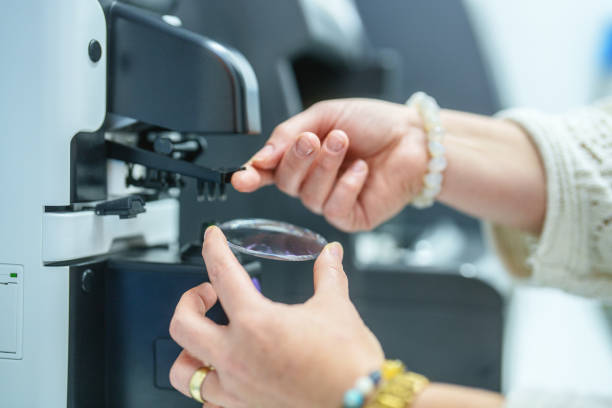 istock Optician using an ophthalmology medical instrument for measuring glass lens 2177760341