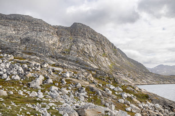 Arctic landscape with rocks and mountains facing the fjord outside the Greenlandic capital Nuuk