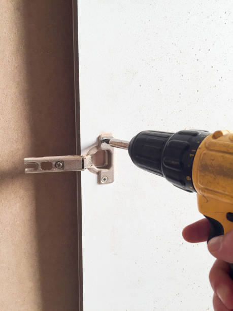 istock Screwing with an electric drill 2177761452