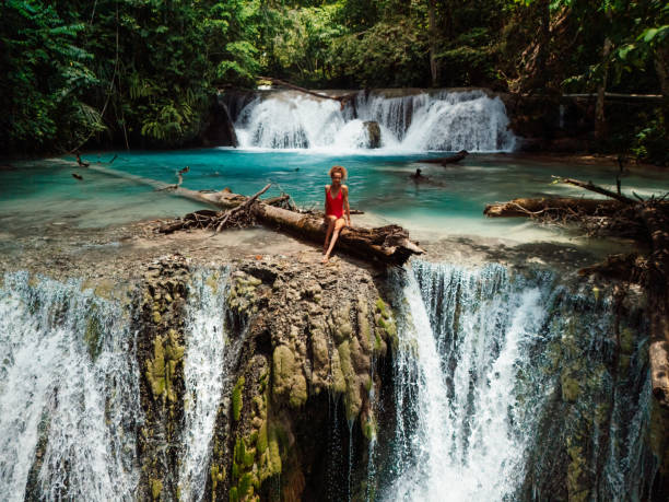 istock Woman on scenic cascade waterfall in Central Sulawesi, drone view 2177763801