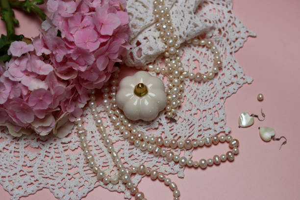 istock Crochet white lace and pearl necklace on a table 2177764601