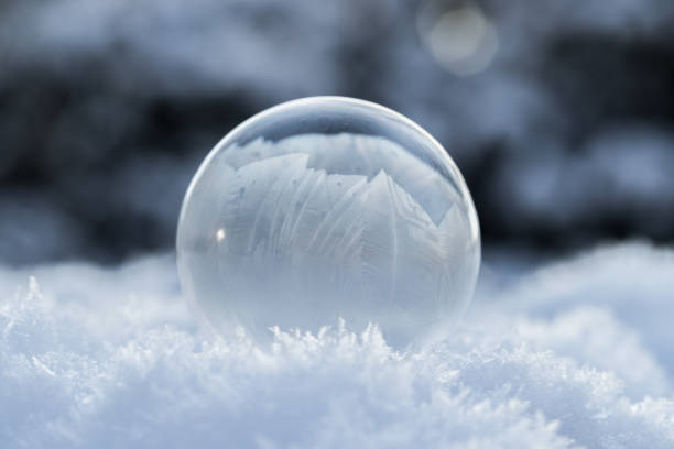 istock soap bubbles freezing to ice closeup in snow landscape with blurred background and ice crystal details 2177765543