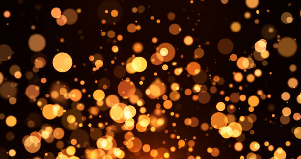 istock Abstract background with golden particles, golden light with particles shining bokeh on dark background, christmas concept 2177765689