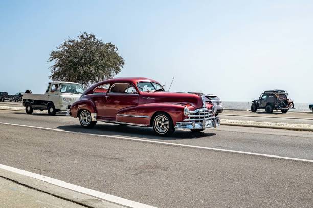 Gulfport, MS - October 04, 2023: Wide angle  front corner view of a 1948 Pontiac Streamliner Silver Streak Coupe at a local car show.