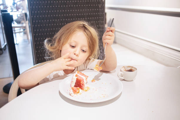 Close-Up Portrait Of Girl Eating Ice Cream