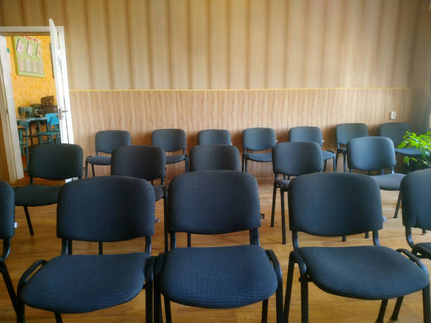 istock Empty chairs arranged neatly in a cozy, light-filled room ready for an engaging gathering during the afternoon 2177772605