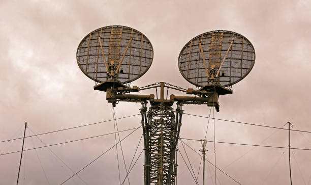 istock Twin Radar Dishes Pierce the Cloudy Sky 2177772855
