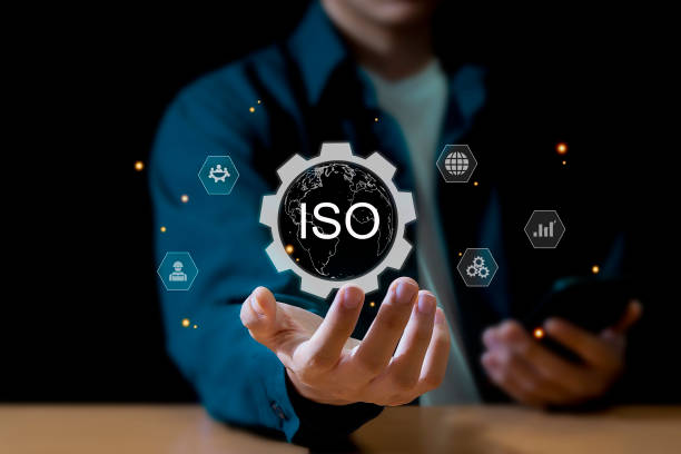 istock Businessman ISO symbol showing quality assurance on virtual screen 2177775560