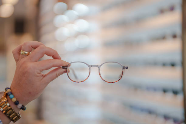 istock Holding eyeglasses in the optician's 2177776058