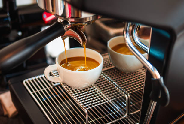 istock Professional espresso machine while preparing  espressos coffee cup in a coffee shop. Close-up of espresso pouring from the coffee machine 2177776633