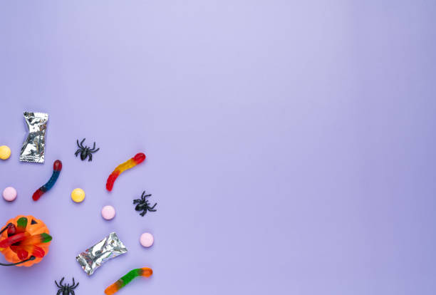 istock Assorted colorful candies over purple background with copy space 2177780990