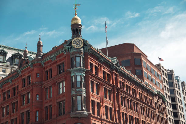 istock Historic red brick building with a golden clock tower in Washington DC under a clear sky 2177782465