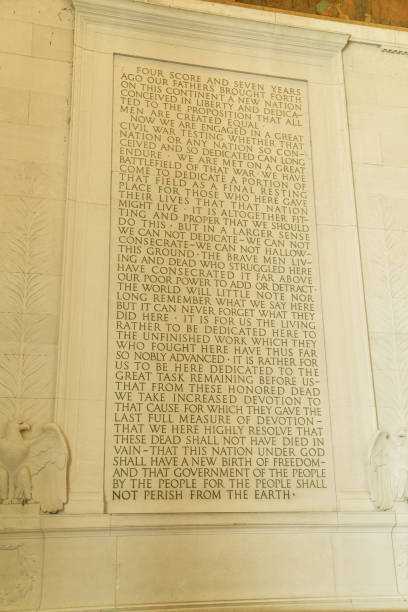 The Gettysburg Address displayed in the Capitol building of Washington DC The Gettysburg Address, a historic speech by Abraham Lincoln, is inscribed on the wall of the Capitol building in Washington DC, reflecting the significance of democracy and freedom in America. civil rights act stock pictures, royalty-free photos & images