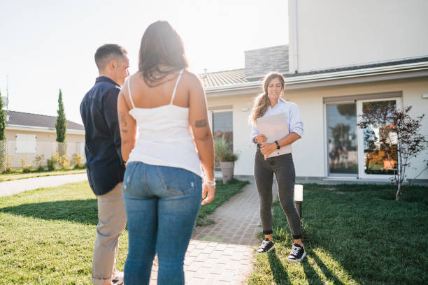 istock real state agent showing the new house 2177783706