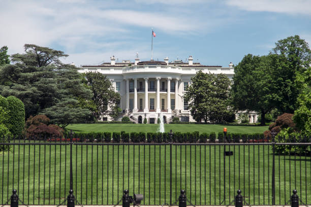 istock The White House in springtime with lush greenery and a clear blue sky in Washington DC 2177786413