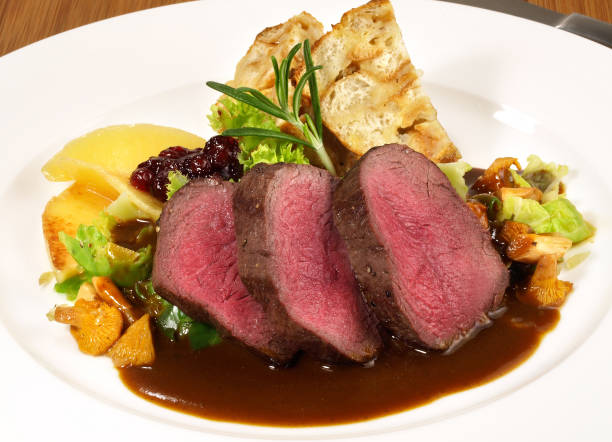 Deer with Vegetables on Cranberry Sauce - Wild Game Meat