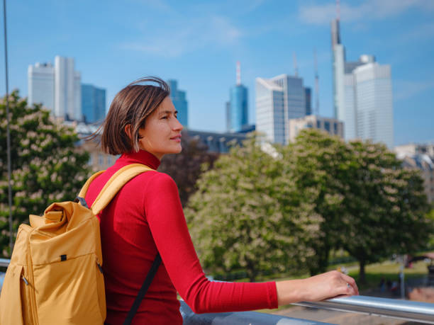 istock Tourist woman explores modern Frankfurt, 2177787623