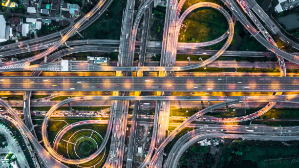 istock Aerial view elevated road and traffic junctions, Modern construction design traffic ways traffic jams, Road interchange or highway intersection with busy urban traffic Junction network of transportation. 2177789720