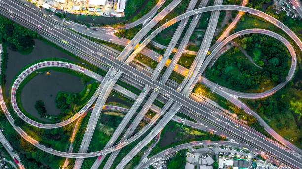 istock Aerial view elevated road and traffic junctions, Modern construction design traffic ways traffic jams, Road interchange or highway intersection with busy urban traffic Junction network of transportation. 2177789735